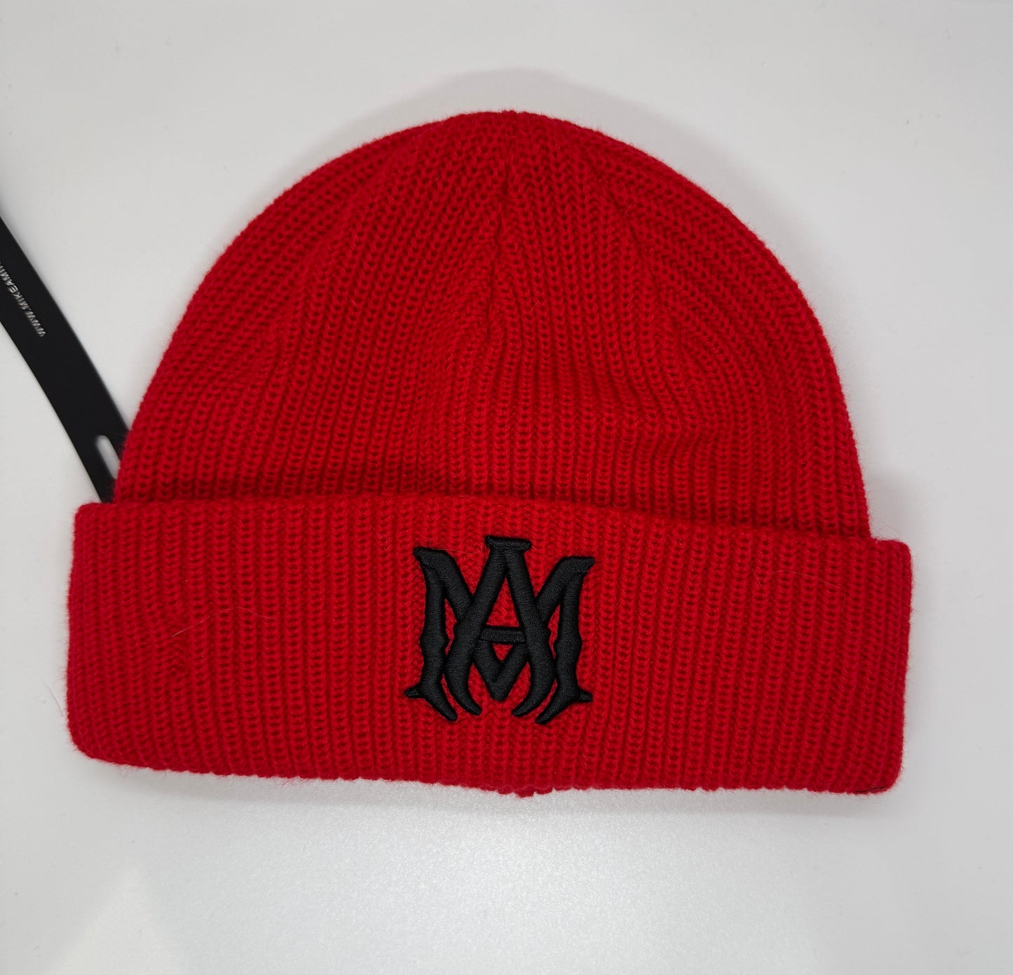 Amiri hat AM logo